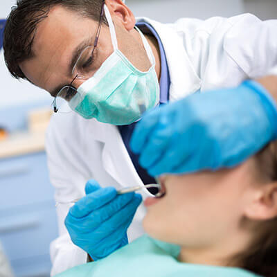 Dentist working on a patient with the mouth open